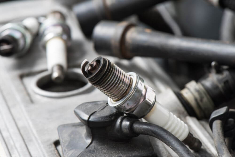 Can Worn Spark Plugs Make My Car Idle Roughly?